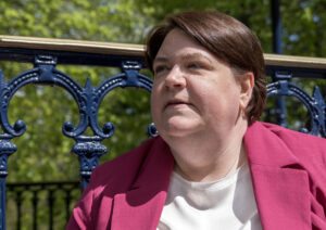 Shelley Bell sitting on the bandstand looking into the distance