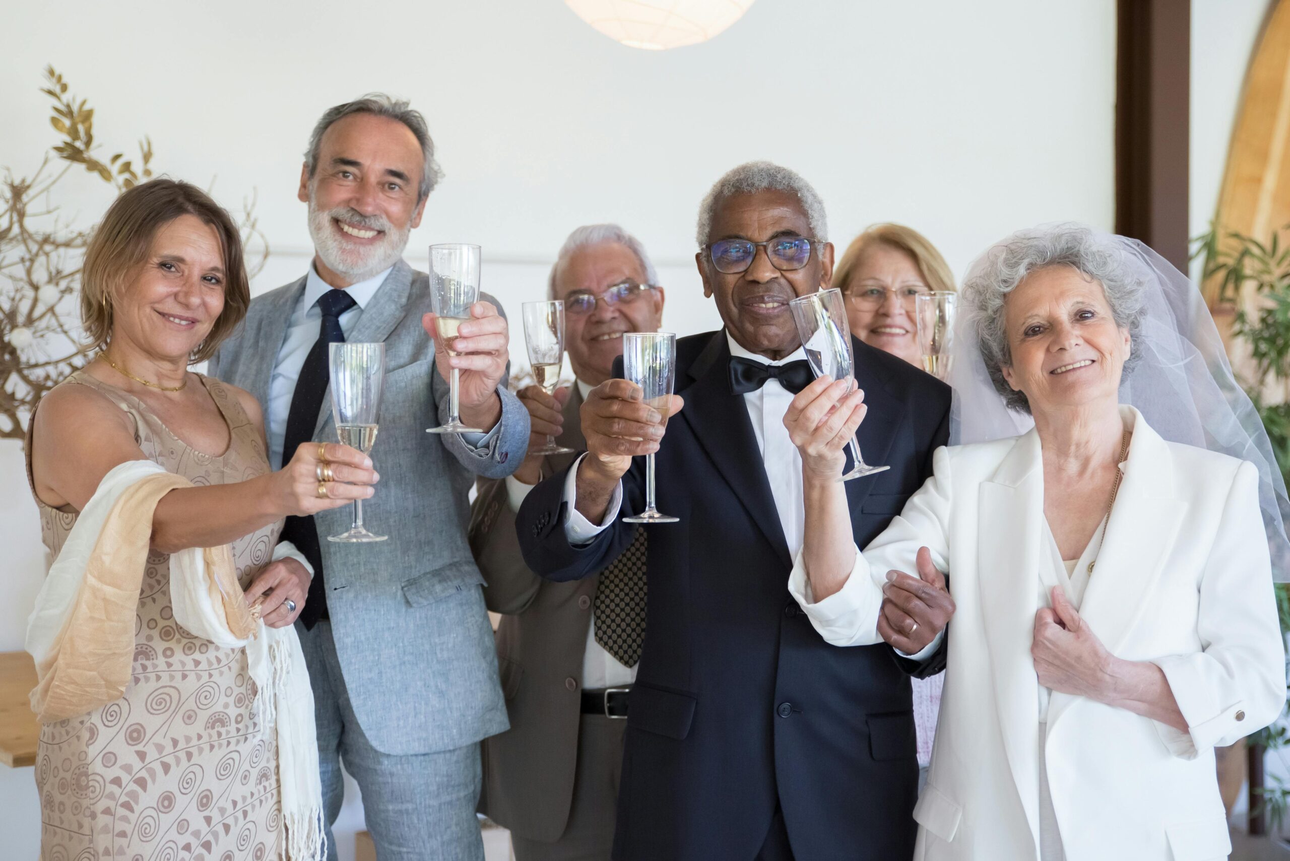 The Bride, groom and guests all raise a glass in celebration of their wedding and to toast thier future together.